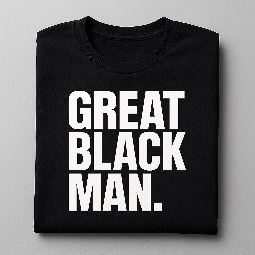 A folded black t shirt with the words "Great Black Man". printed across the chest